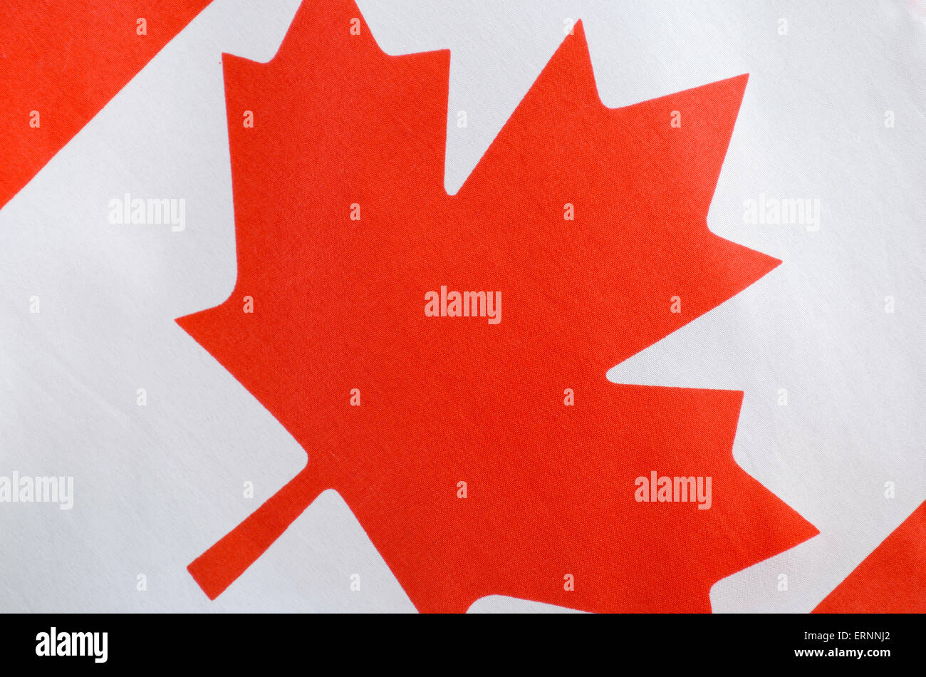Canadian red and white maple leaf flag for Canada Day, July 1, celebration and national holidays, closeup. Stock Photo