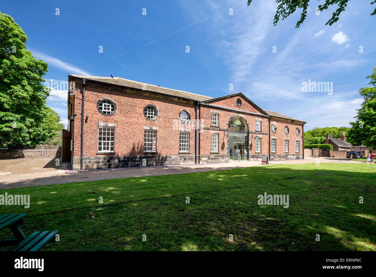 Astley Park Chorley, Lancashire: The Coach House building houses meeting rooms and cafe next to historic Astley Hall Stock Photo