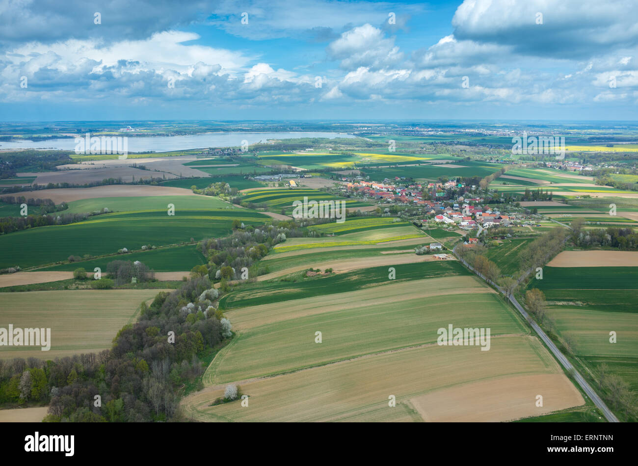 Aerial view on a small village surrounded by green fields Stock Photo ...