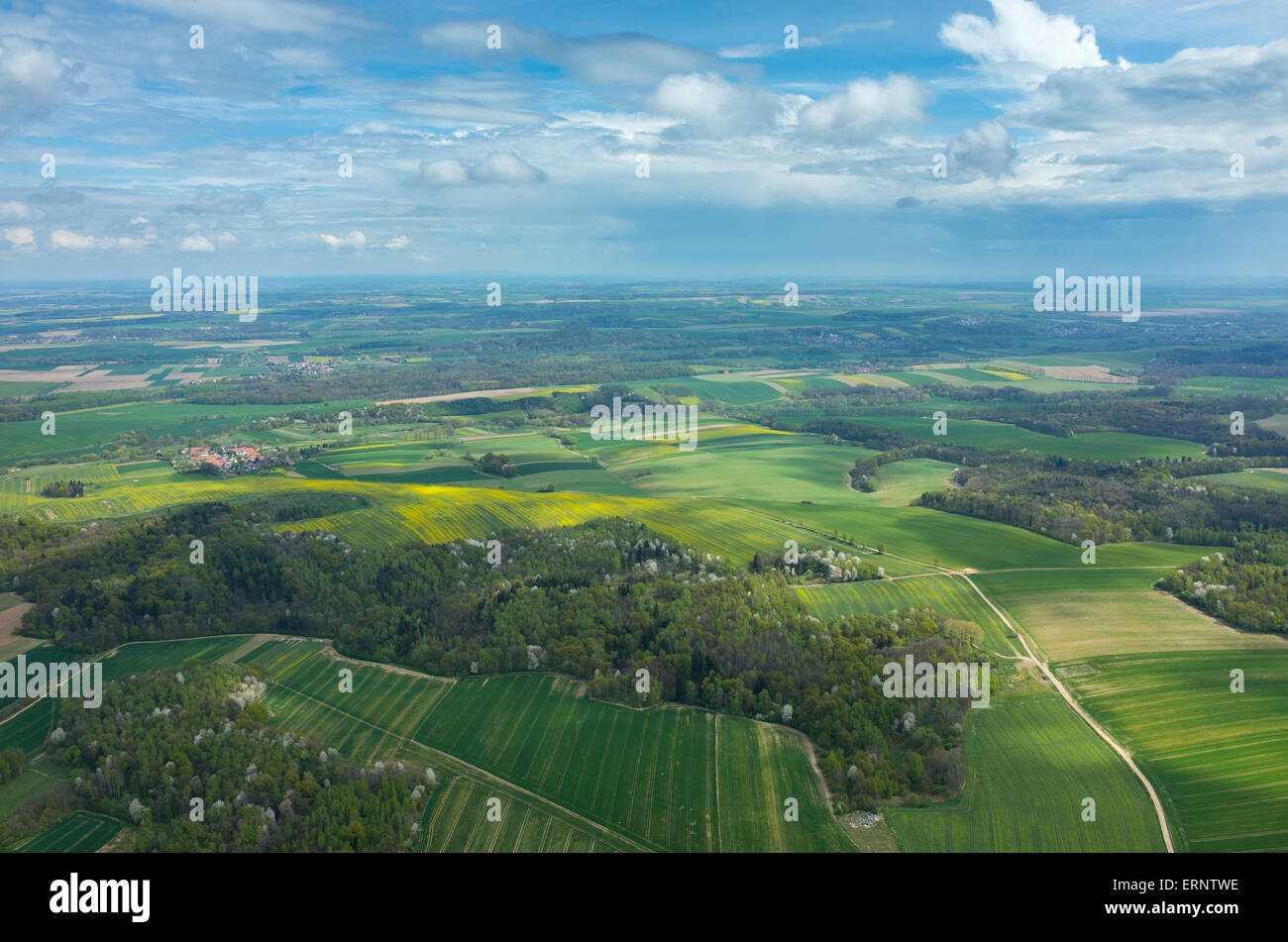 Aerial view on a small village surrounded by green fields Stock Photo ...