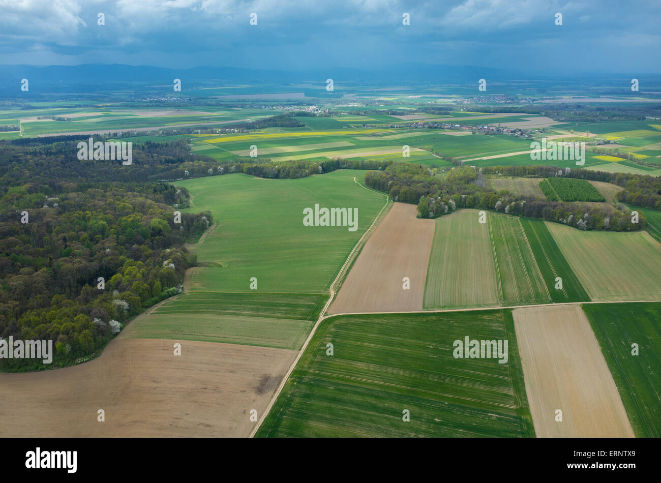 Aerial view on a small village surrounded by green fields Stock Photo ...