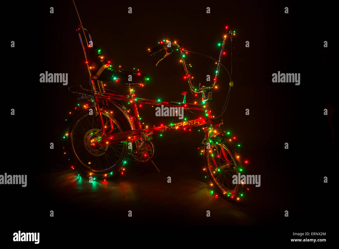 Original Raleigh Chopper Mark II decorated with Christmas lights. Stock Photo