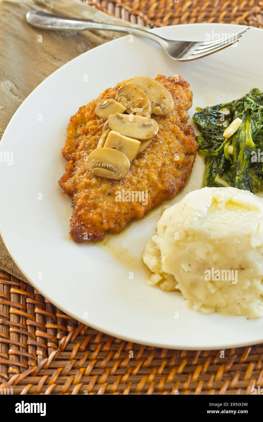 Crispy breaded chicken marsala with mashed potatoes and broccoli rabe