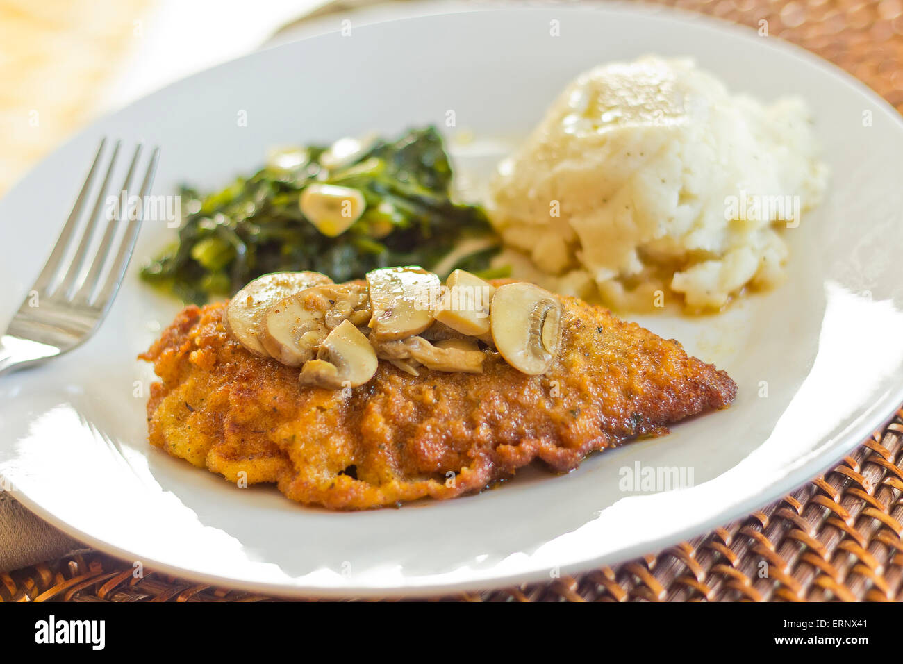 Crispy breaded chicken marsala with mashed potatoes and broccoli rabe