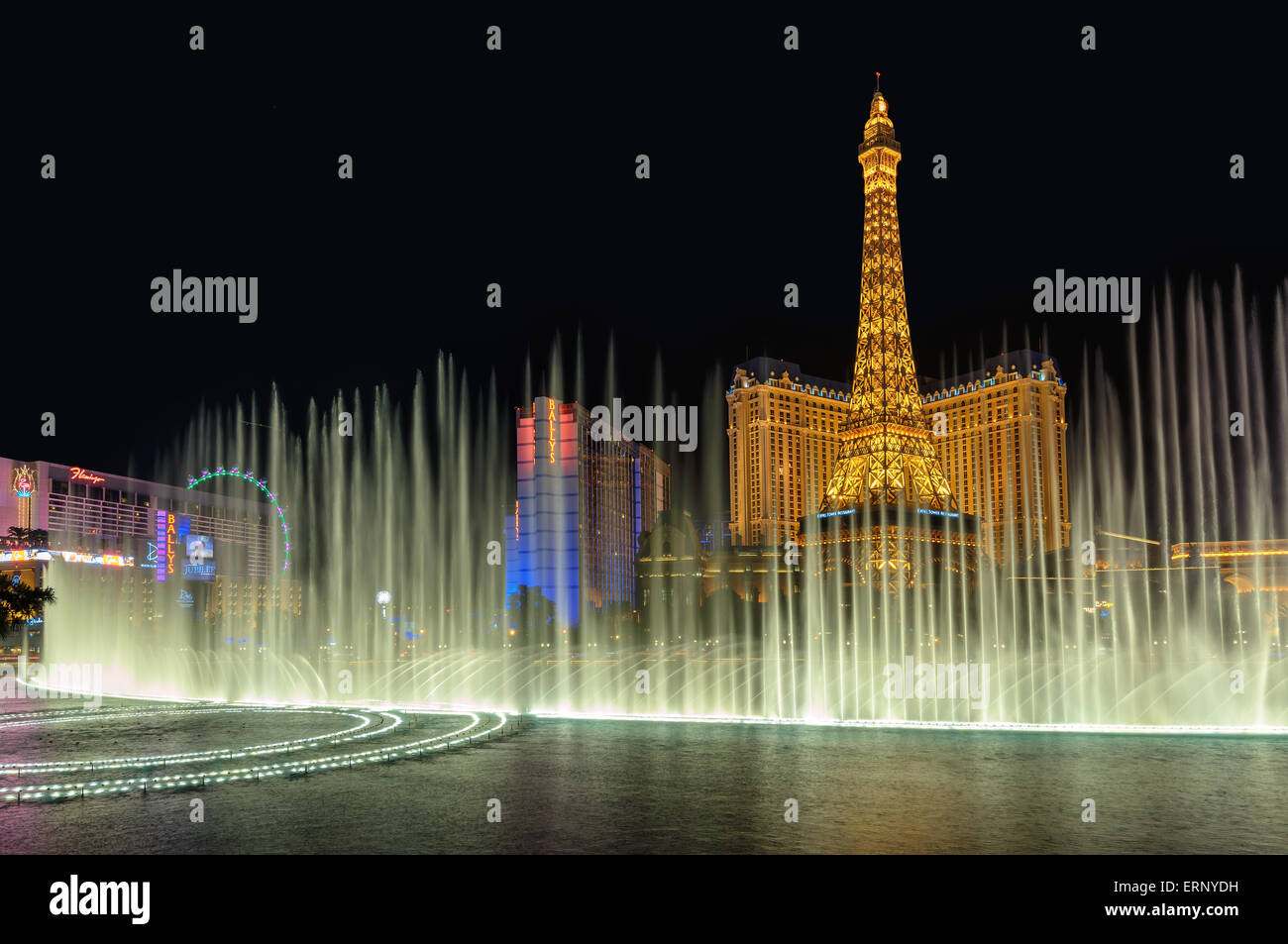 Bellagio Fountain and Paris hotel, night illumination on Las Vegas Strip Stock Photo