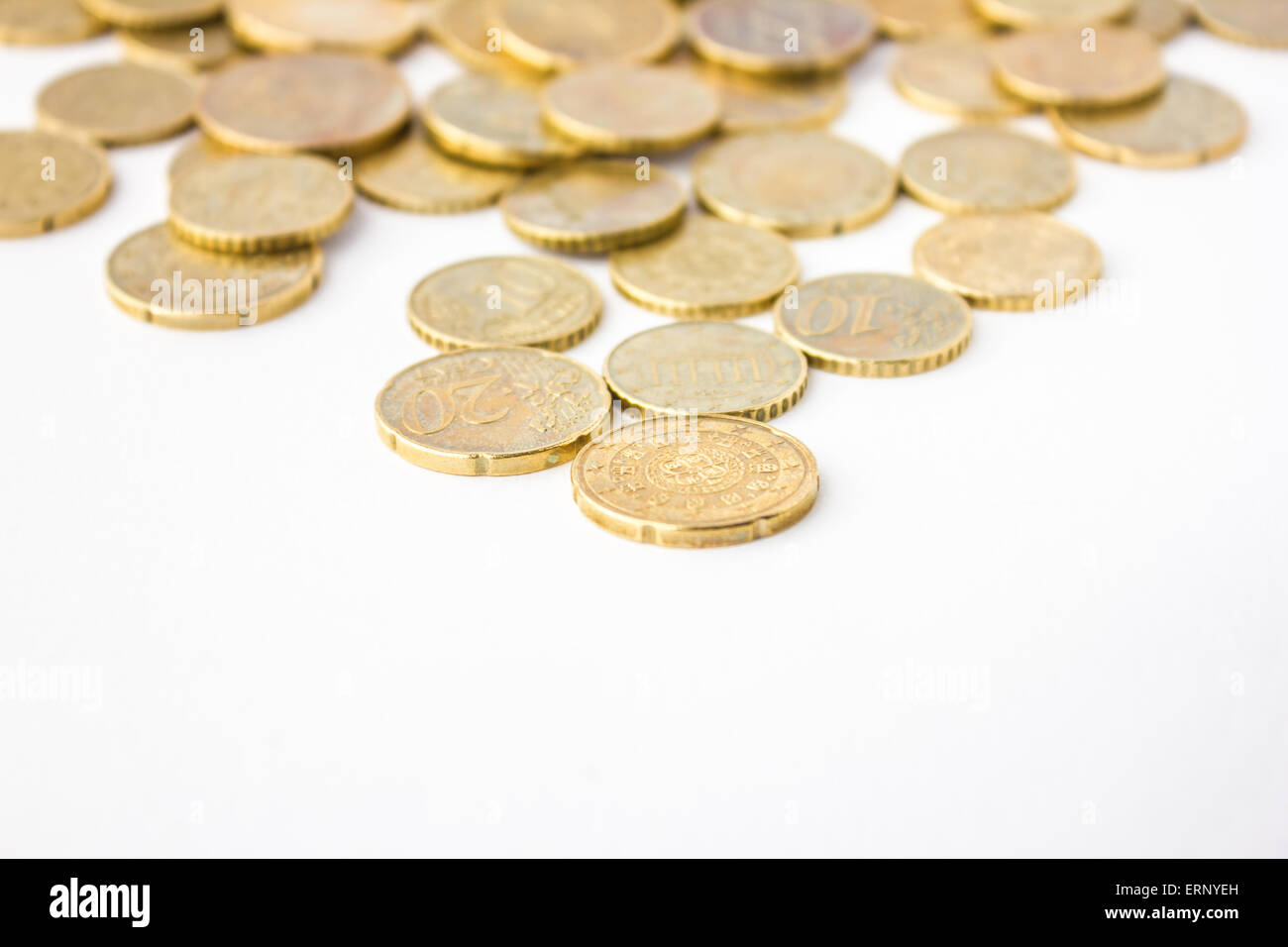 Golden European coins in white background Stock Photo - Alamy