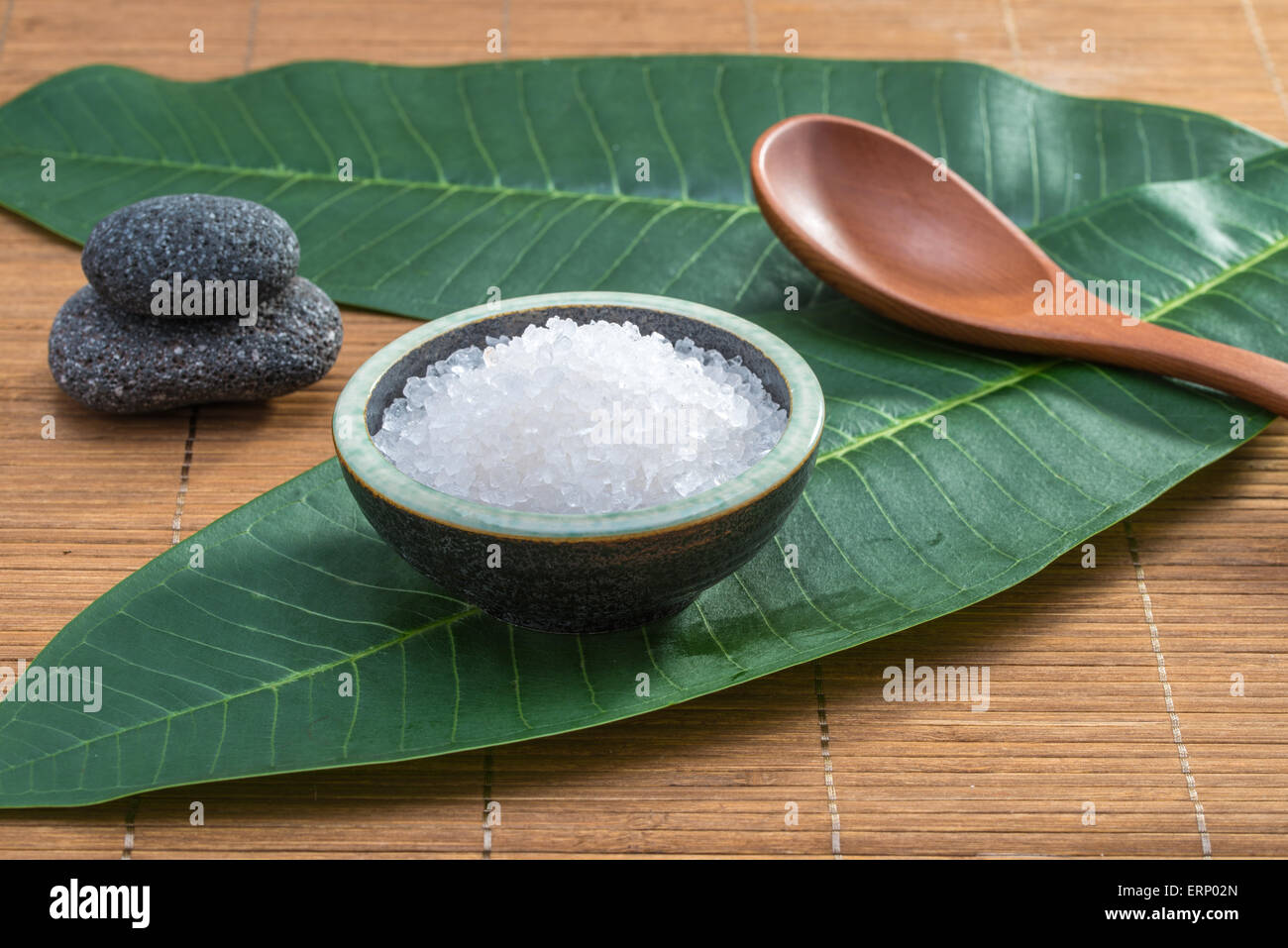 salt, spoon, stone, on green leaf for health spa material Stock Photo