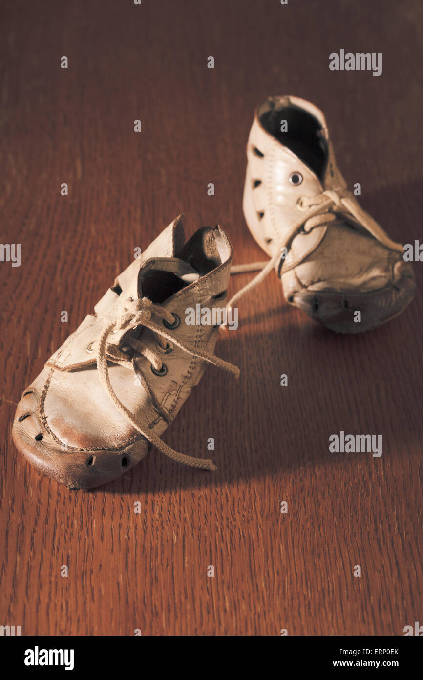 Old baby shoes Stock Photo - Alamy