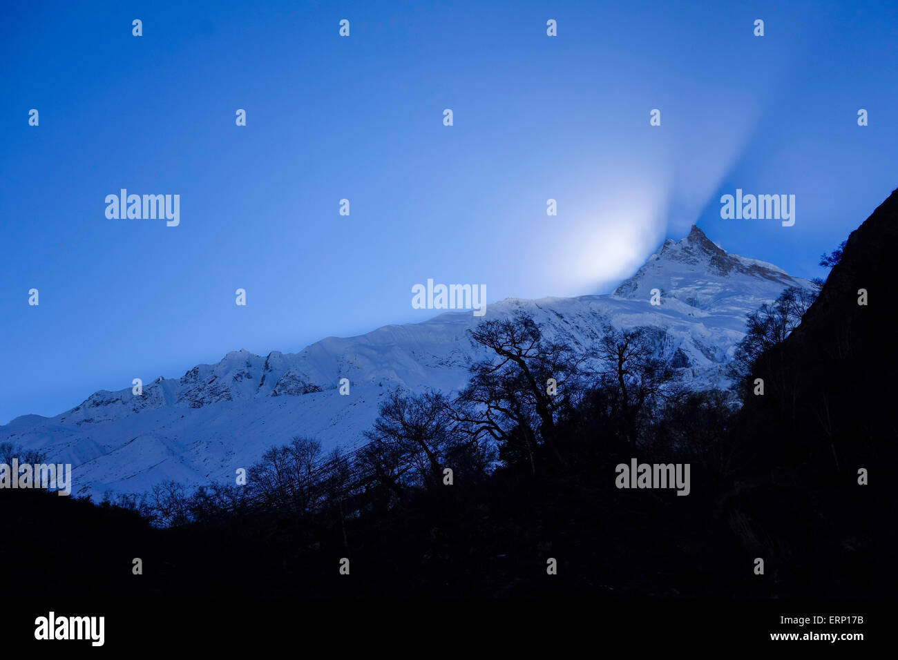 Manaslu at sunset.  At 8156 meters (26,759 feet) Manaslu is the eighth highest peak on the planet. Stock Photo