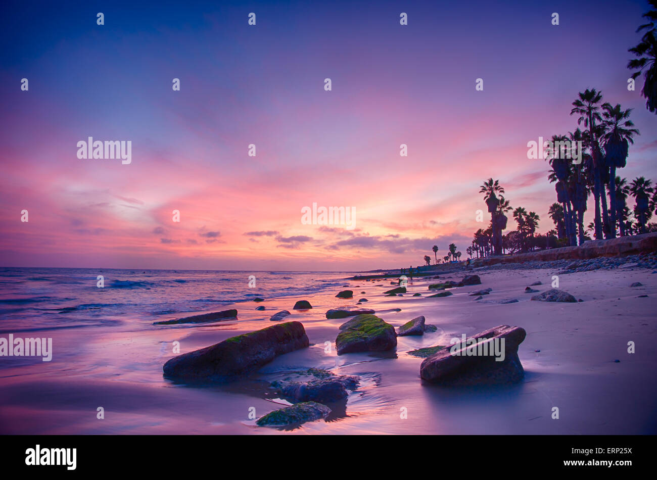 Rocks and boulders strewn on beach in Ventura, southern California at ...