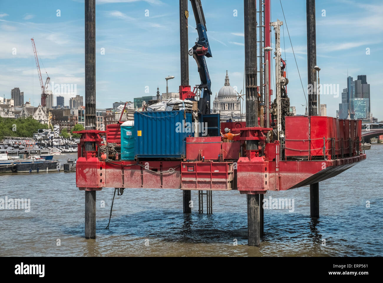 Drilling rig on River Thames, London, with St Pauls Cathedral in skyline background. Stock Photo