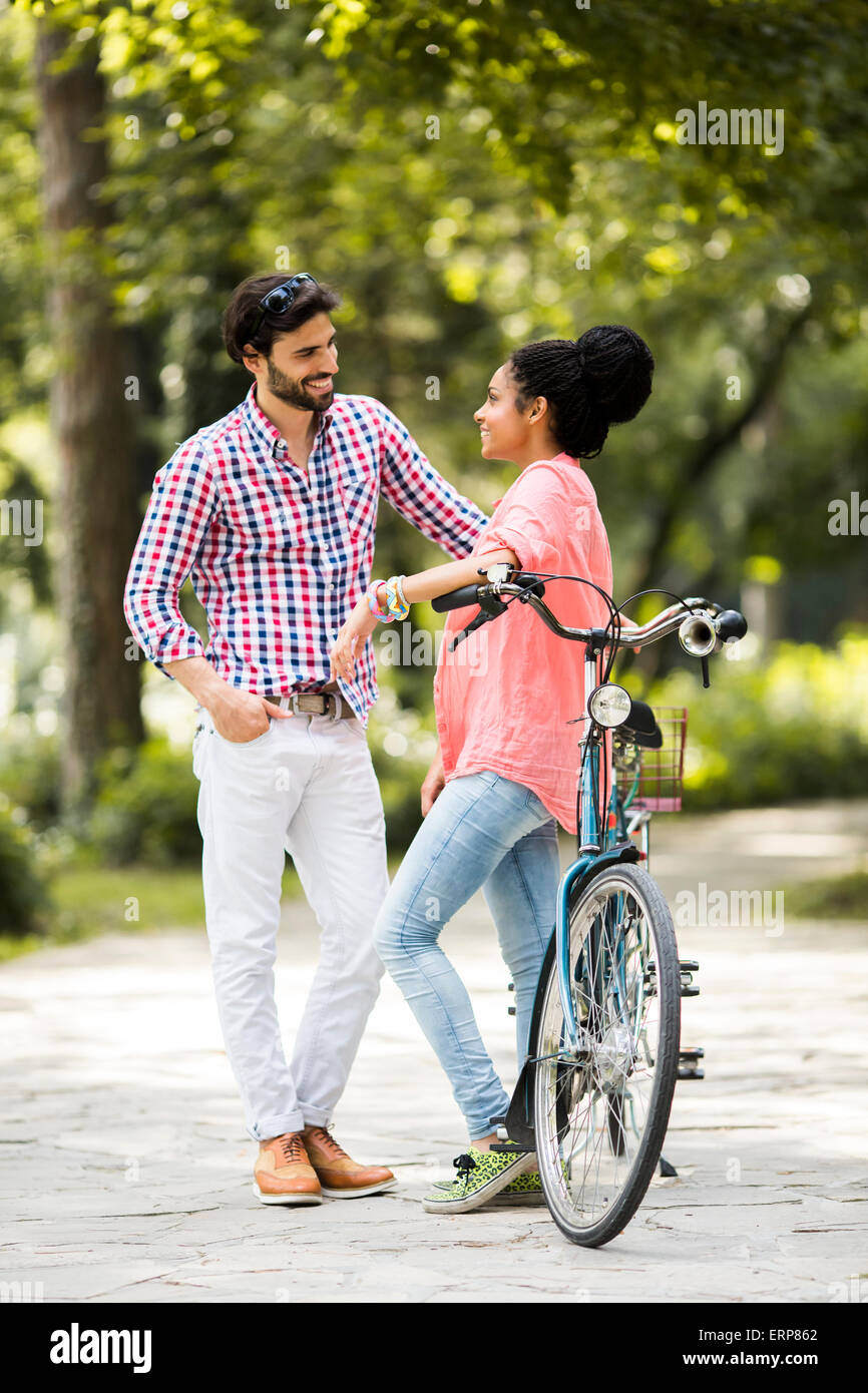 Happy valentines love story concept of a romantic couple against chalk  drawings background. Male riding his girlfriend in a front bicycle basket  Stock Photo - Alamy