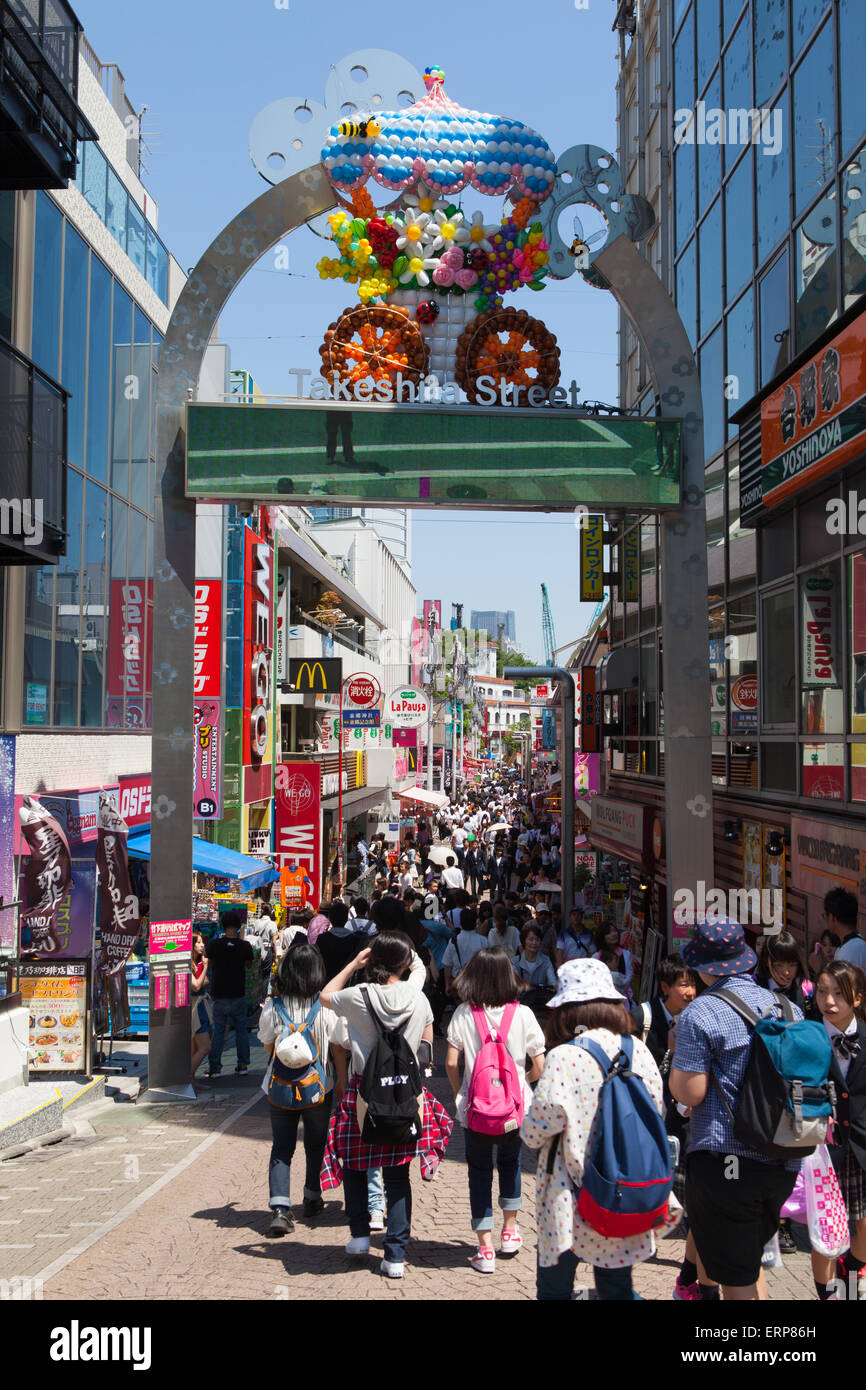 Locals and tourists walking at Harajuku's Takeshita street, known for it's Colorful shops and Punk Manga - Anime overall look. Stock Photo