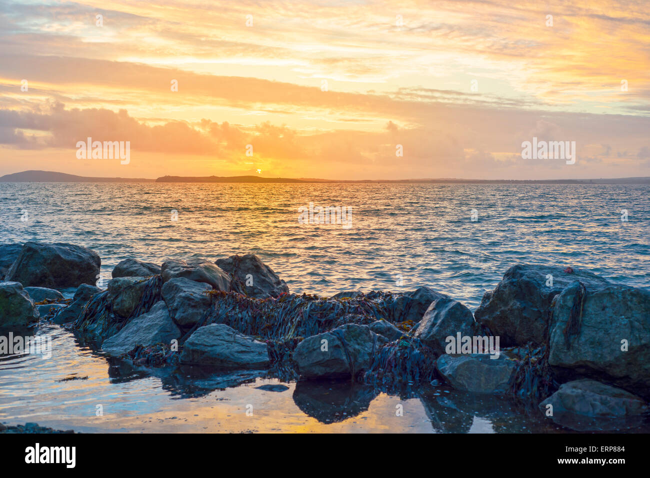 beal beach near ballybunion on the wild atlantic way ireland with a beautiful yellow sunset Stock Photo