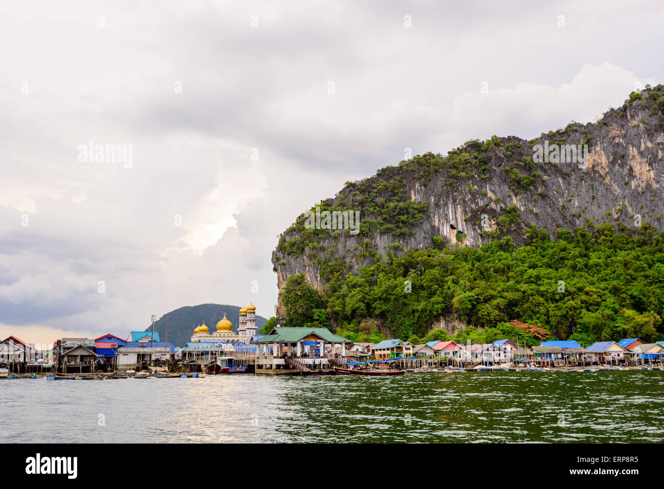 Landscape Koh Panyee or Punyi island village is floating over the sea during a boat tour at the Ao Phang Nga Bay National Park, Stock Photo