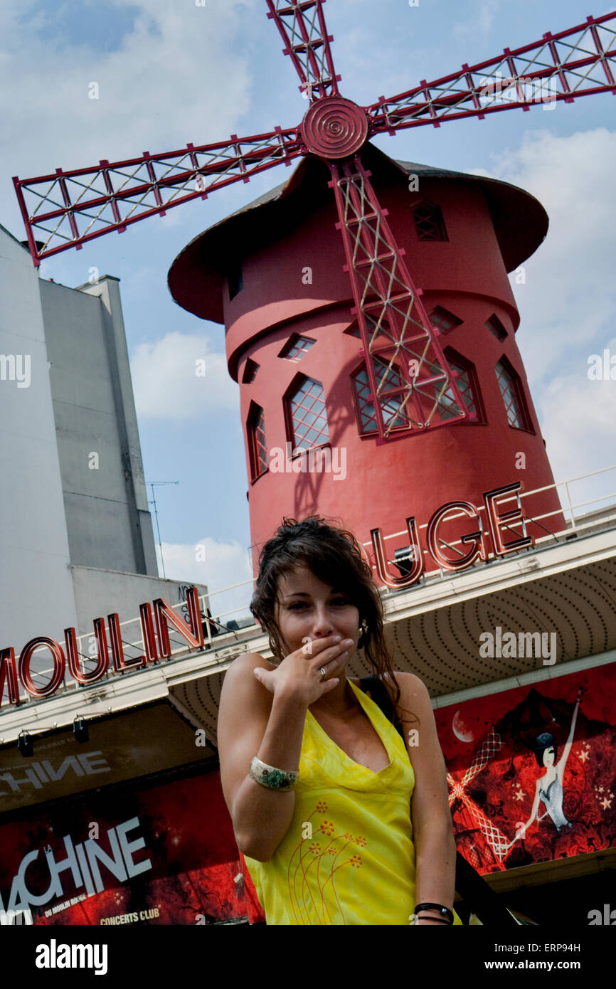 A girl sending a kiss at famous Moulin Rouge cabaret & night club in Paris, France Stock Photo