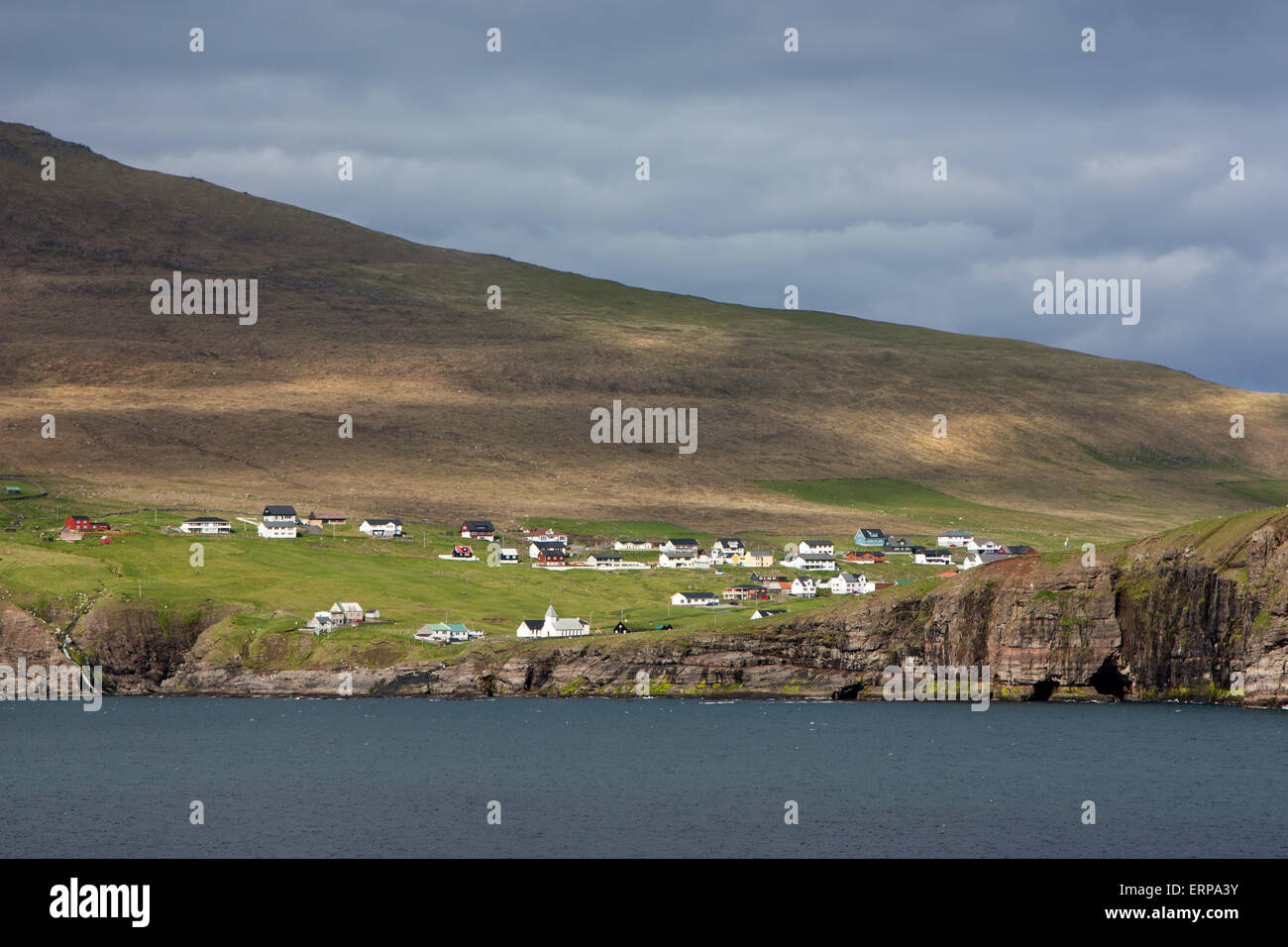 Faroe Islands, remote village on a rocky cliff Stock Photo