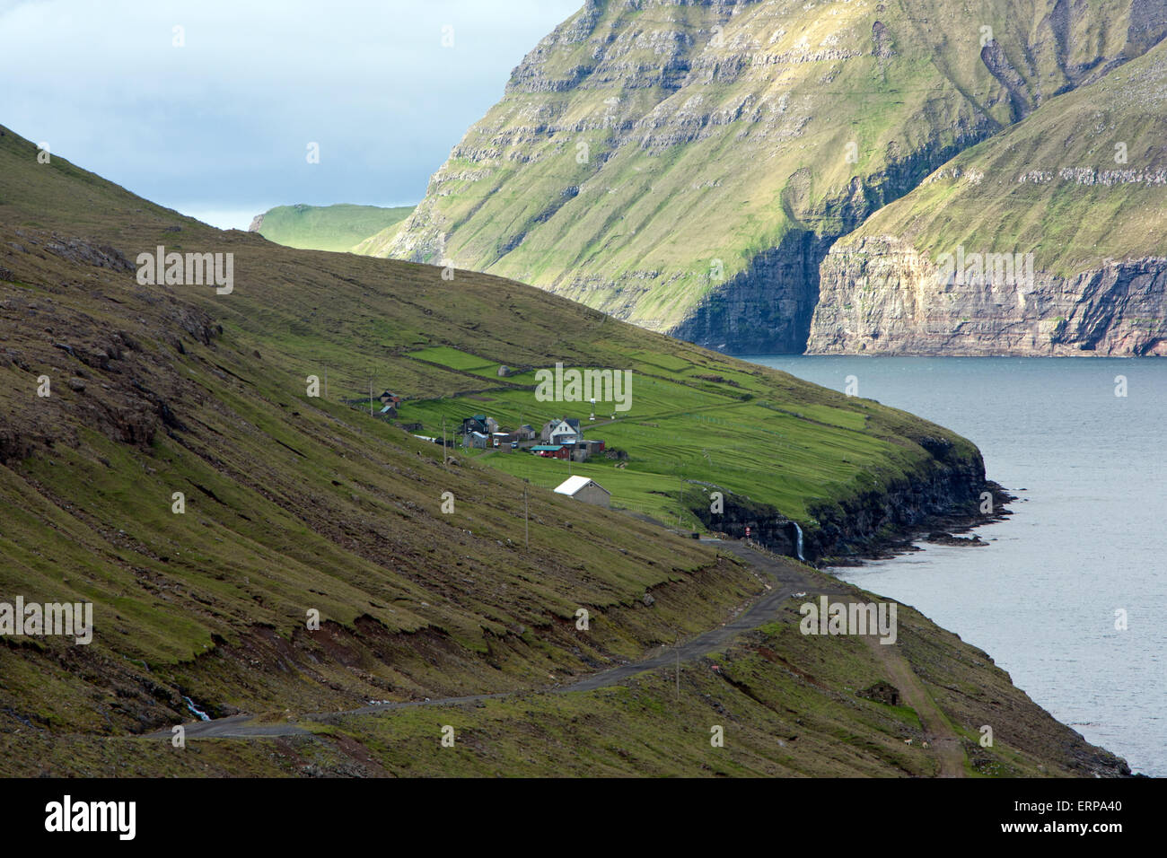 Faroe Islands, Fjord surrounded by green mountains Stock Photo