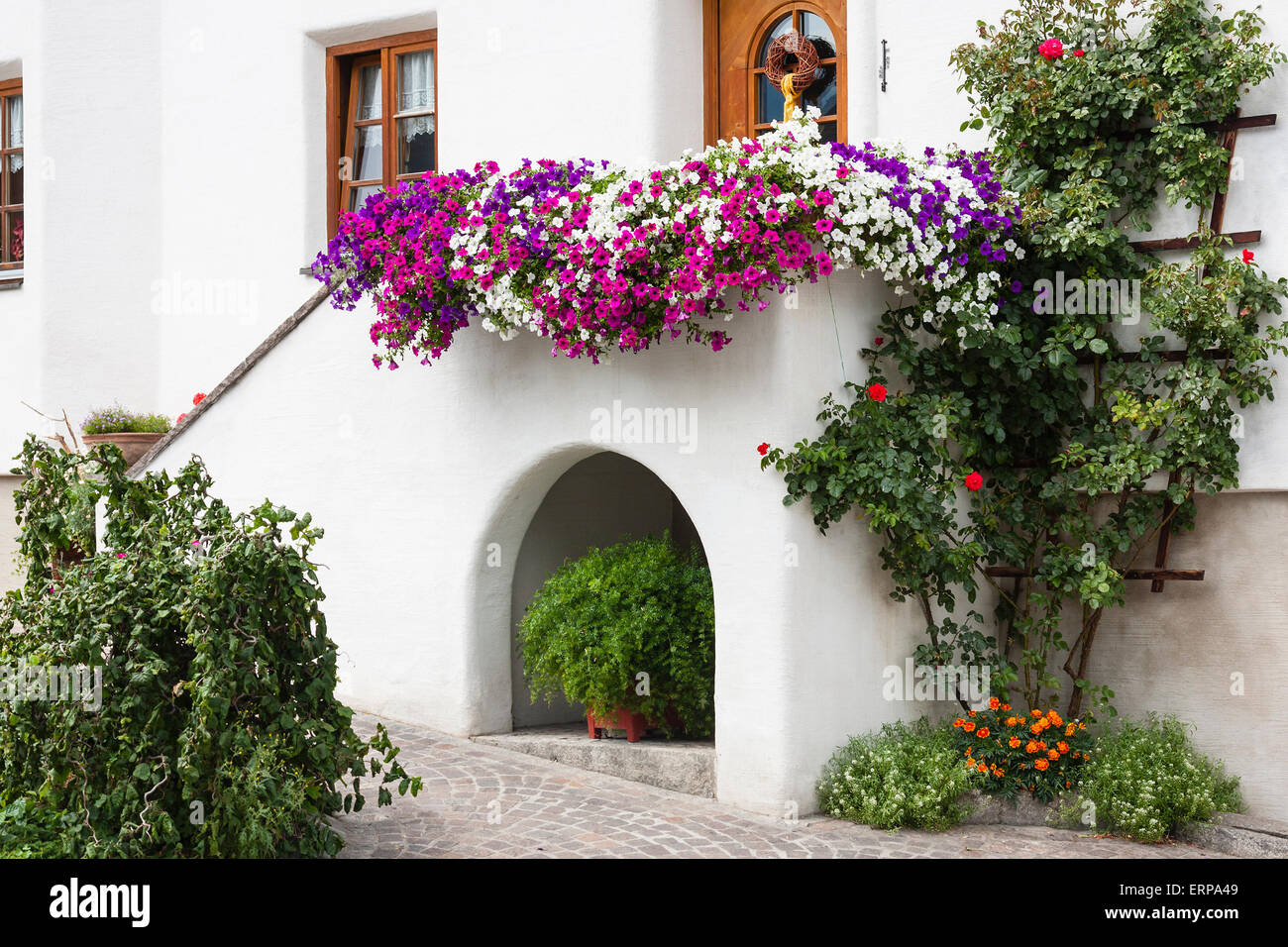 Ornaments and flowers at a village house in Jerzens in the Pitztal, Austria Stock Photo