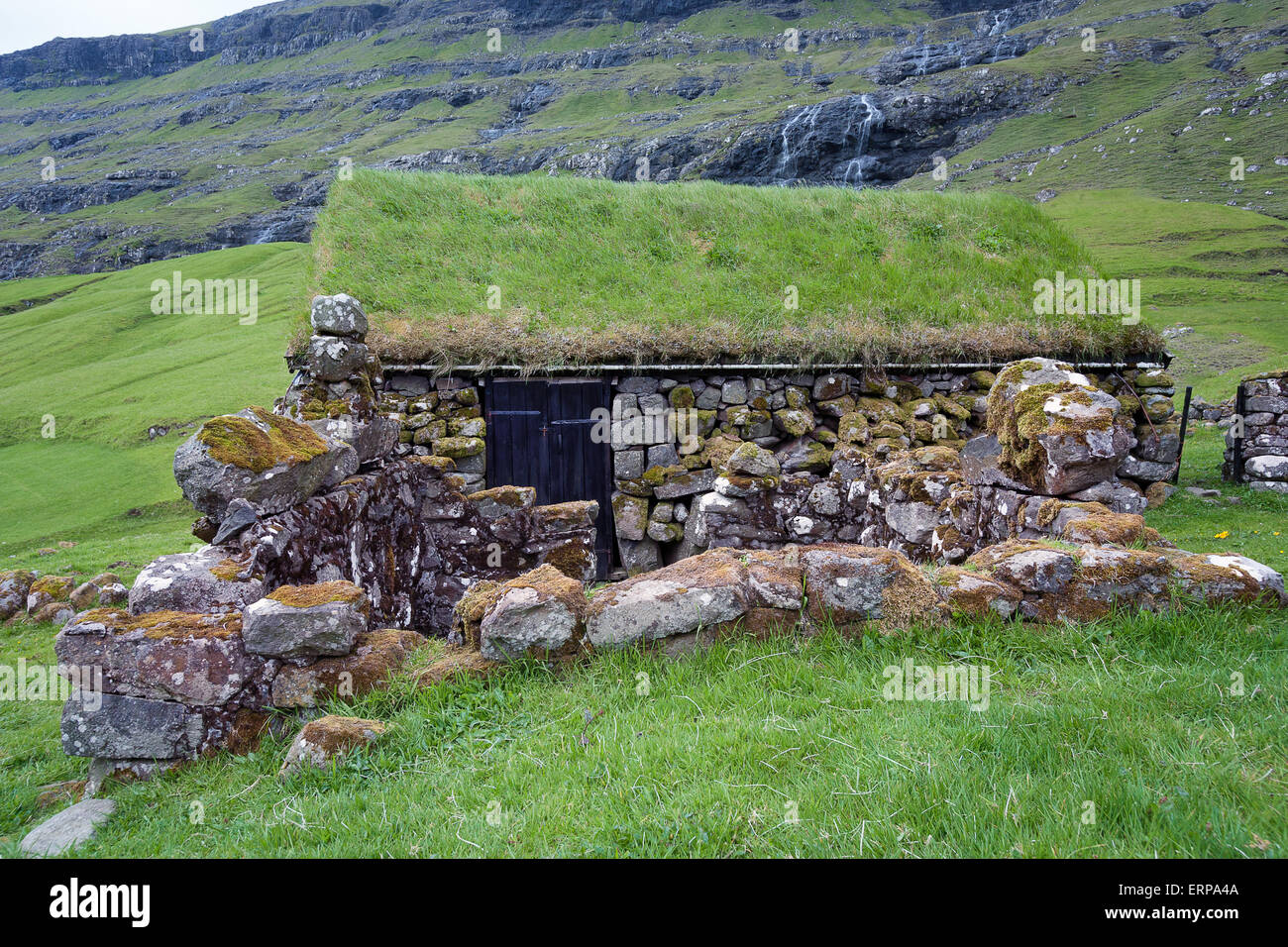 Stone house with grass roof Stock Photo