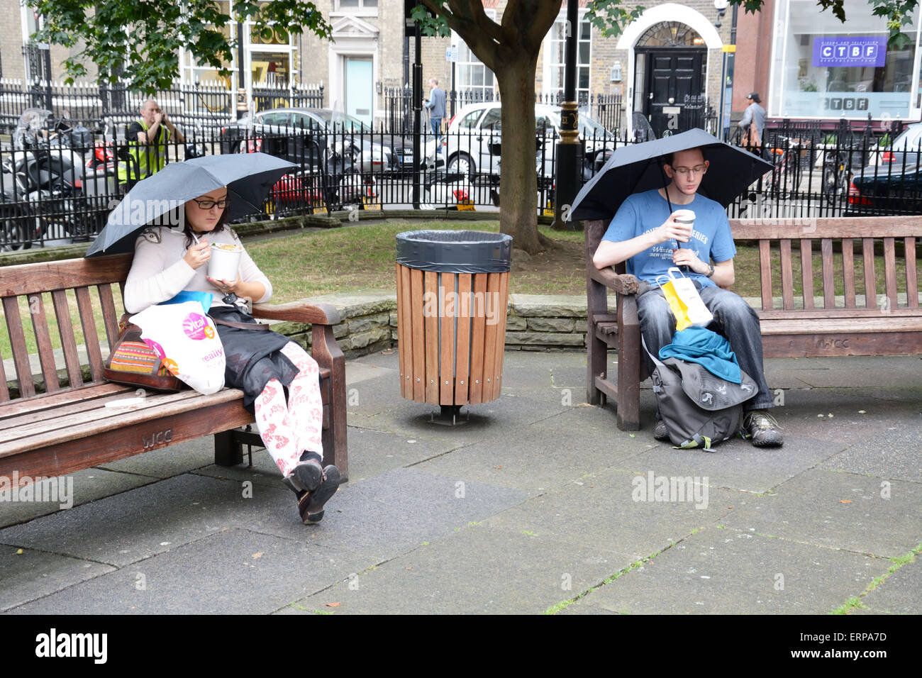 Lunch in the rain, London. Stock Photo