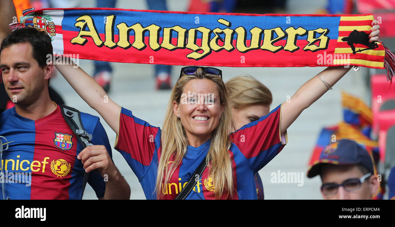 FC Barcelona fan holds a scarf written on, antimadridista (anti fans of  Real Madrid Club de Fútbol). The ultras supporter group of Football Club  Barcelona, Boixos Nois (Crazy Boys) have gathered outside