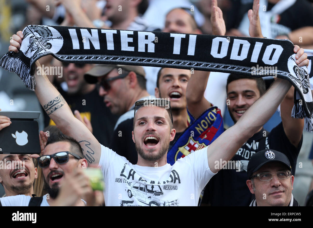 Berlin, Germany. 06th June, 2015. A fan of Juventus holds a scarf prior to  the UEFA Champions League final soccer match between Juventus FC and FC  Barcelona at Olympic Stadium in Berlin,