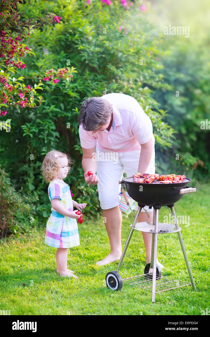 Young loving father and his cute happy toddler daughter, adorable girl