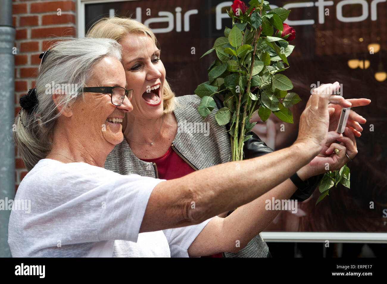 Ringsted, Denmark, June 6th, 2015: Danish PM, Helle Thorning-Schmidt (Soc.dem. read: Labor) (R), meets voters in Ringsted as part of her election campaign. Here a voter have a selfie taken with the PM Credit:  OJPHOTOS/Alamy Live News Stock Photo