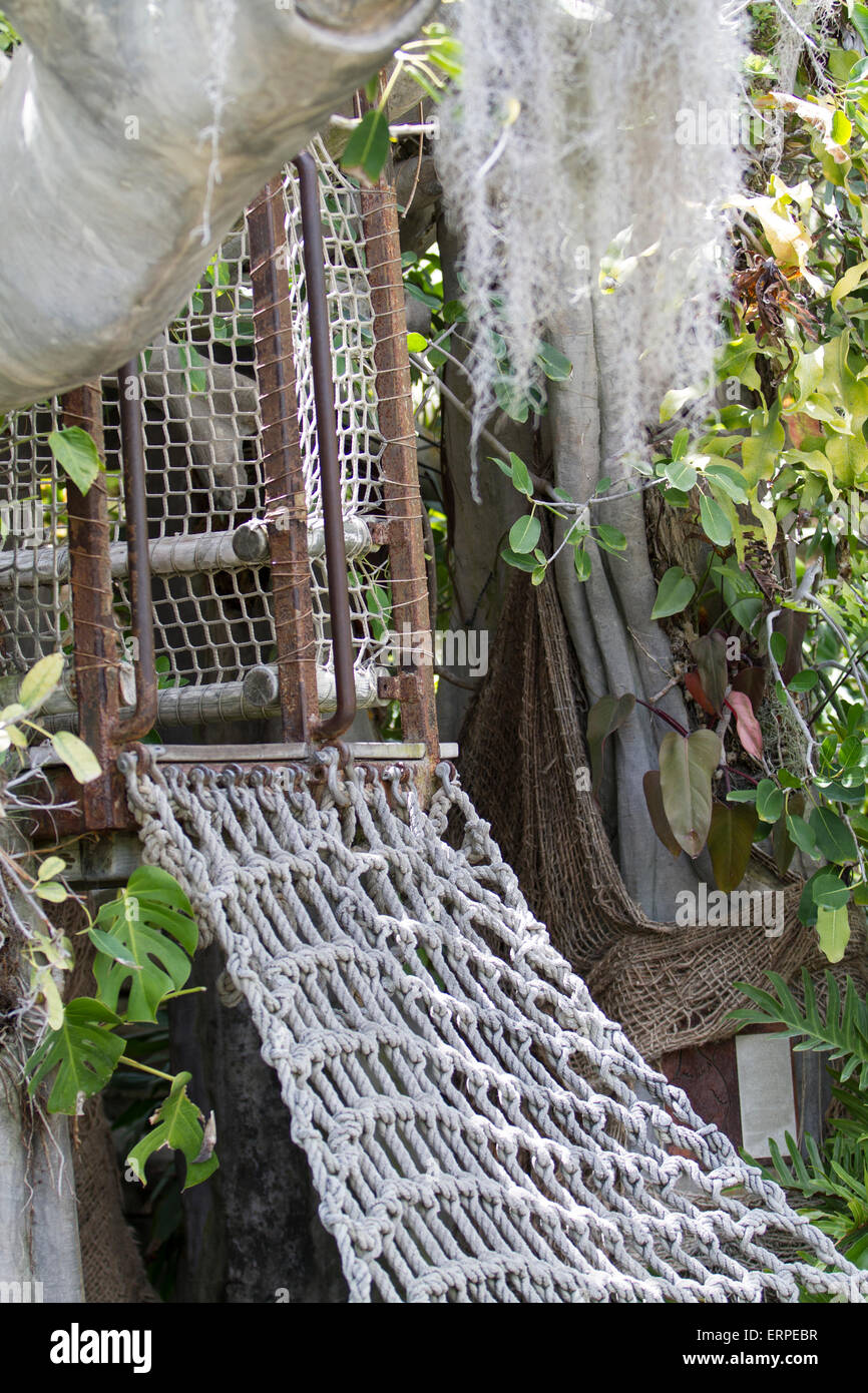 Tree house with a netted stair for kids who want to play pretend games Stock Photo