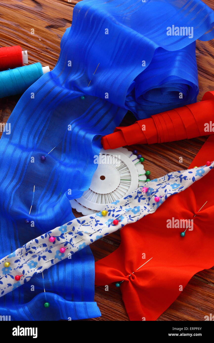 lie on a wooden board thread, needles and tape Stock Photo - Alamy