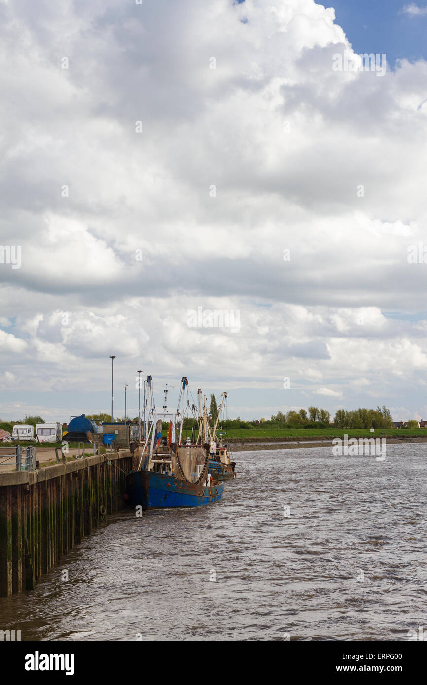 Fishing boats alongside the jetty wall at King's Lynn on the Great Ouse, Norfolk Stock Photo