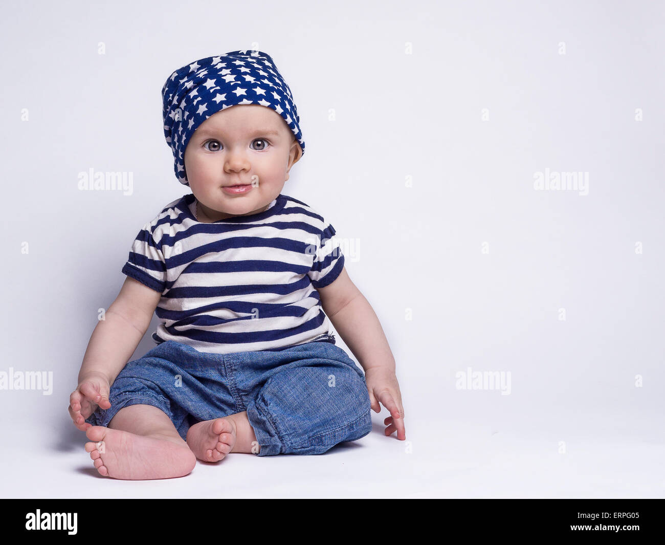Smiling baby in cute outfit Stock Photo