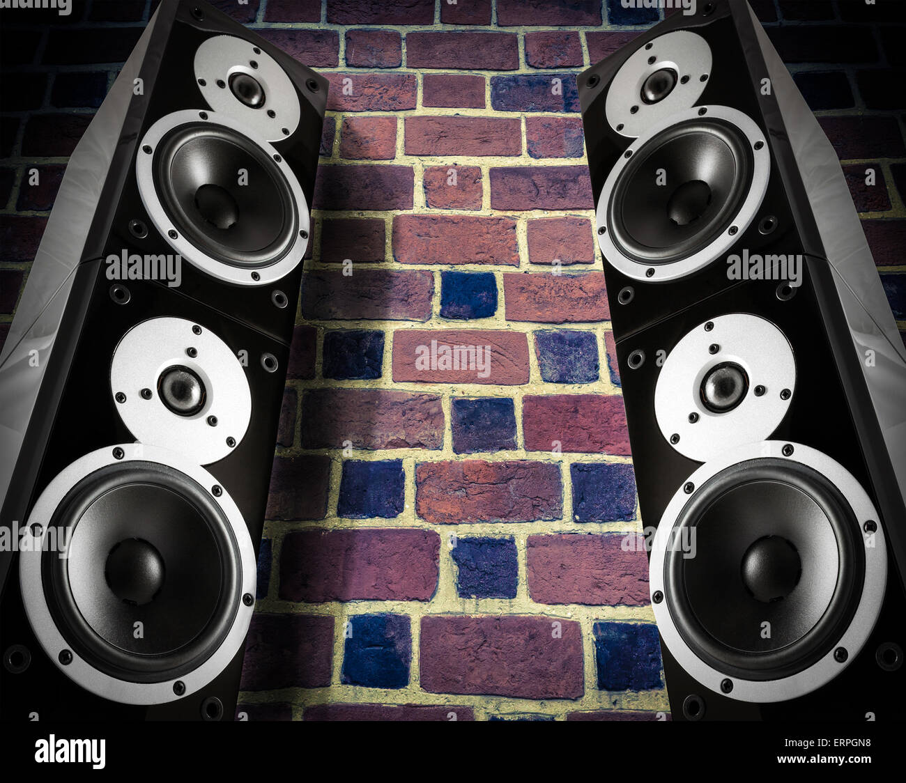 Black high gloss music speakers on brick wall Stock Photo