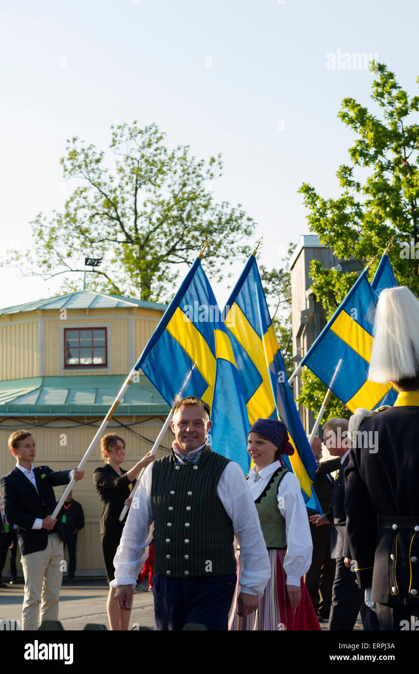 Stockholm, Sweden, 6th June, 2015. The National Day of Sweden. Festivities at Solliden stage, Stockholm, in the presence of the Royal Family. 6th of June is celebrated in traditional fashion: His and Her Majesty the King and Queen join the procession to Skansen where there are speeches‚ flag ceremony‚ singing‚ brass bands and folk music. Credit: Barbro Bergfeldt Alamy Live News Stock Photo