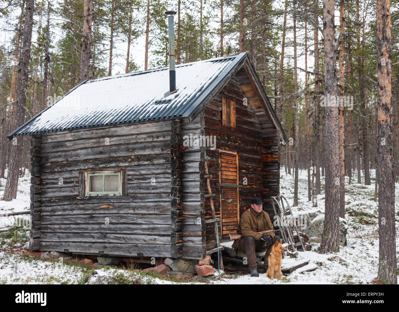 https://c8.alamy.com/comp/ERPY3H/male-hunter-with-his-dog-sitting-outside-his-cottage-in-the-forest-ERPY3H.jpg