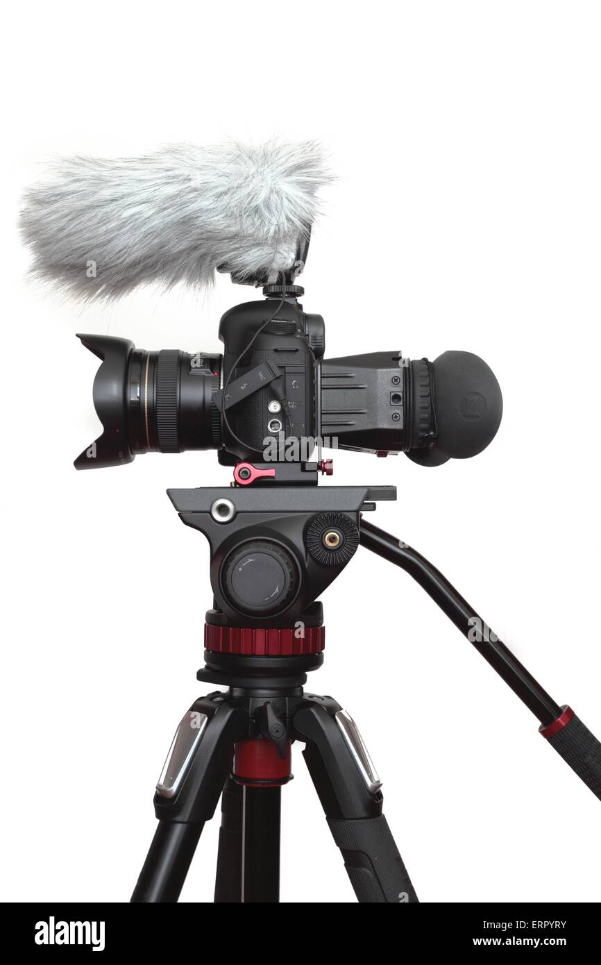 A DSLR camera set up for shooting video footage with a viewfinder fitted to  the rear, and microphone on a tripod Stock Photo - Alamy