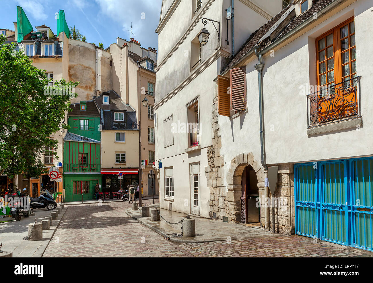 View on narrow street among typical parisian buildings in Paris, France. Stock Photo