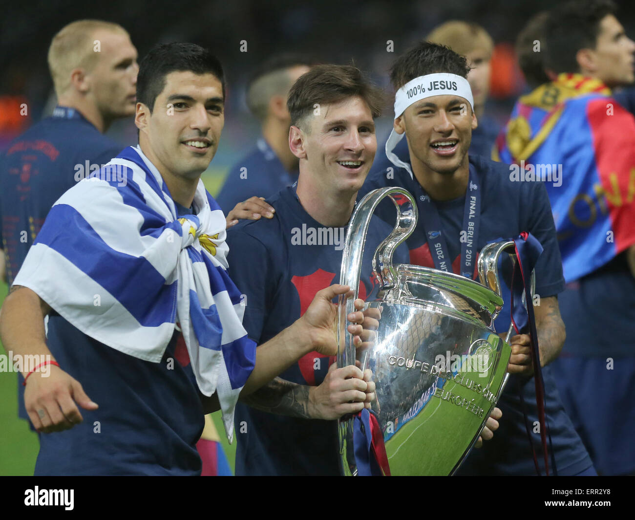 Berlin, Germany. 06th June, 2015. Barcelona's Luis Suarez (L-R), Lionel Messi and Neymar celebrate with the Champions League trophy after winning the UEFA Champions League final soccer match between Juventus FC and FC Barcelona at Olympiastadion in Berlin, Germany, 06 June 2015. Photo: Kay Nietfeld/dpa/Alamy Live News Stock Photo