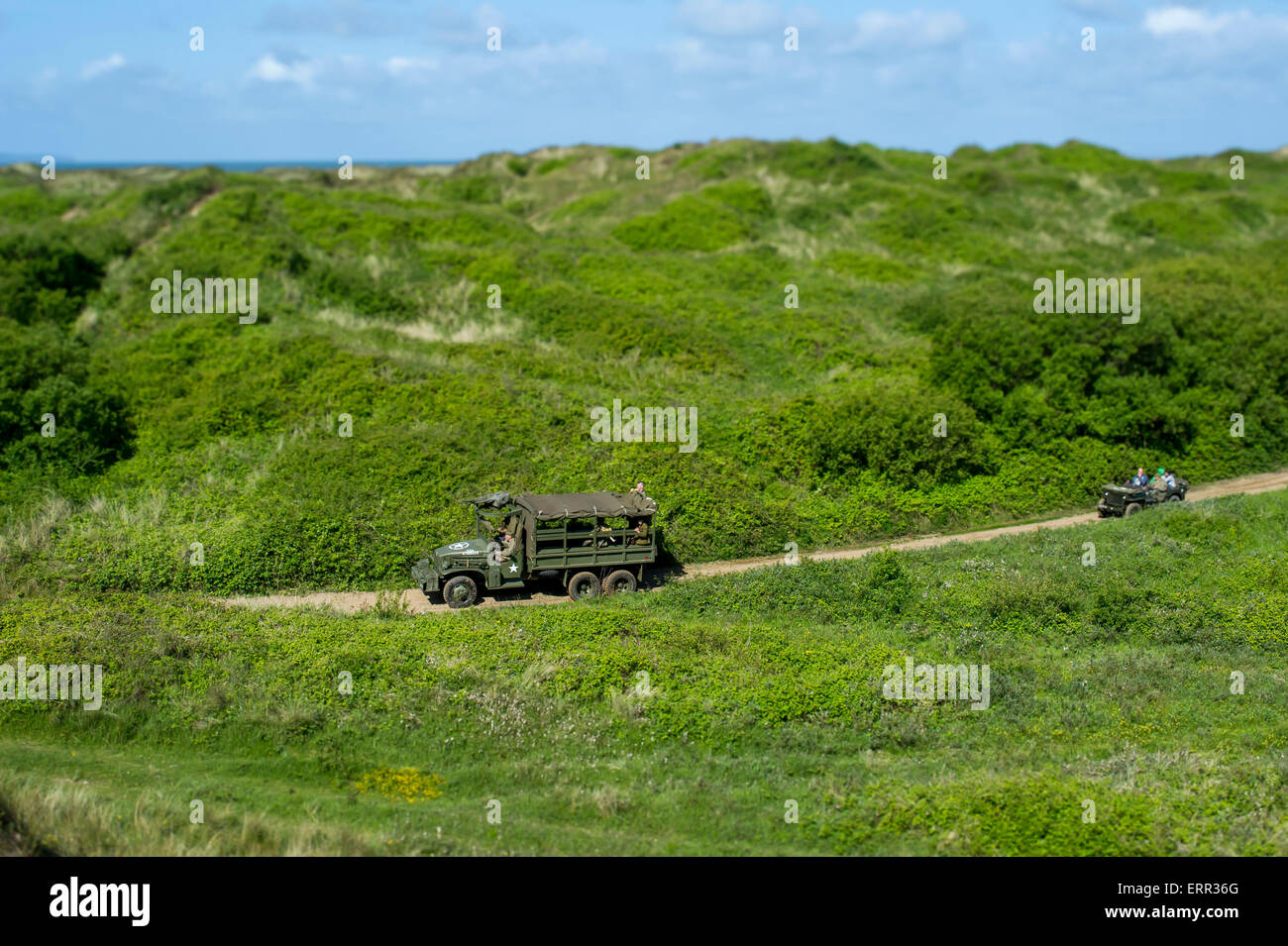Braunton Burrows, Devon. 6th June, 2015.  Living History re-enactors take part in a D-Day commerative service marking 71 years since the D-Day landings. Pictured at Braunton Burrows, Devon where American troops trained for the invasion of Europe on June 6, 1944. Pictured are some of the convoy taking part in the weekends event.    image copyright guy harrop info@guyharrop. Credit:  guy harrop/Alamy Live News Stock Photo