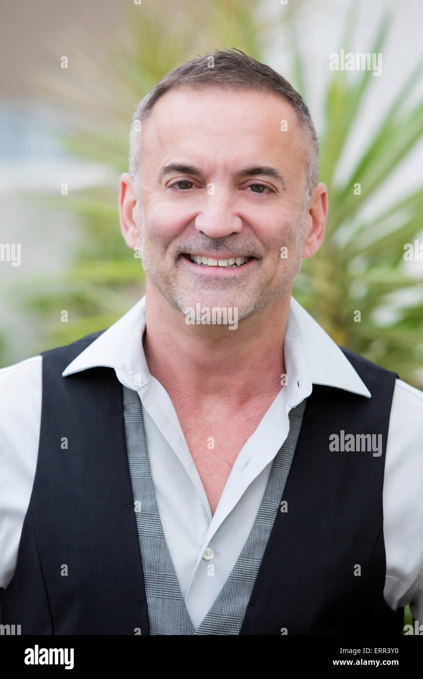 portrait of a businessman standing outside and smiles Stock Photo - Alamy