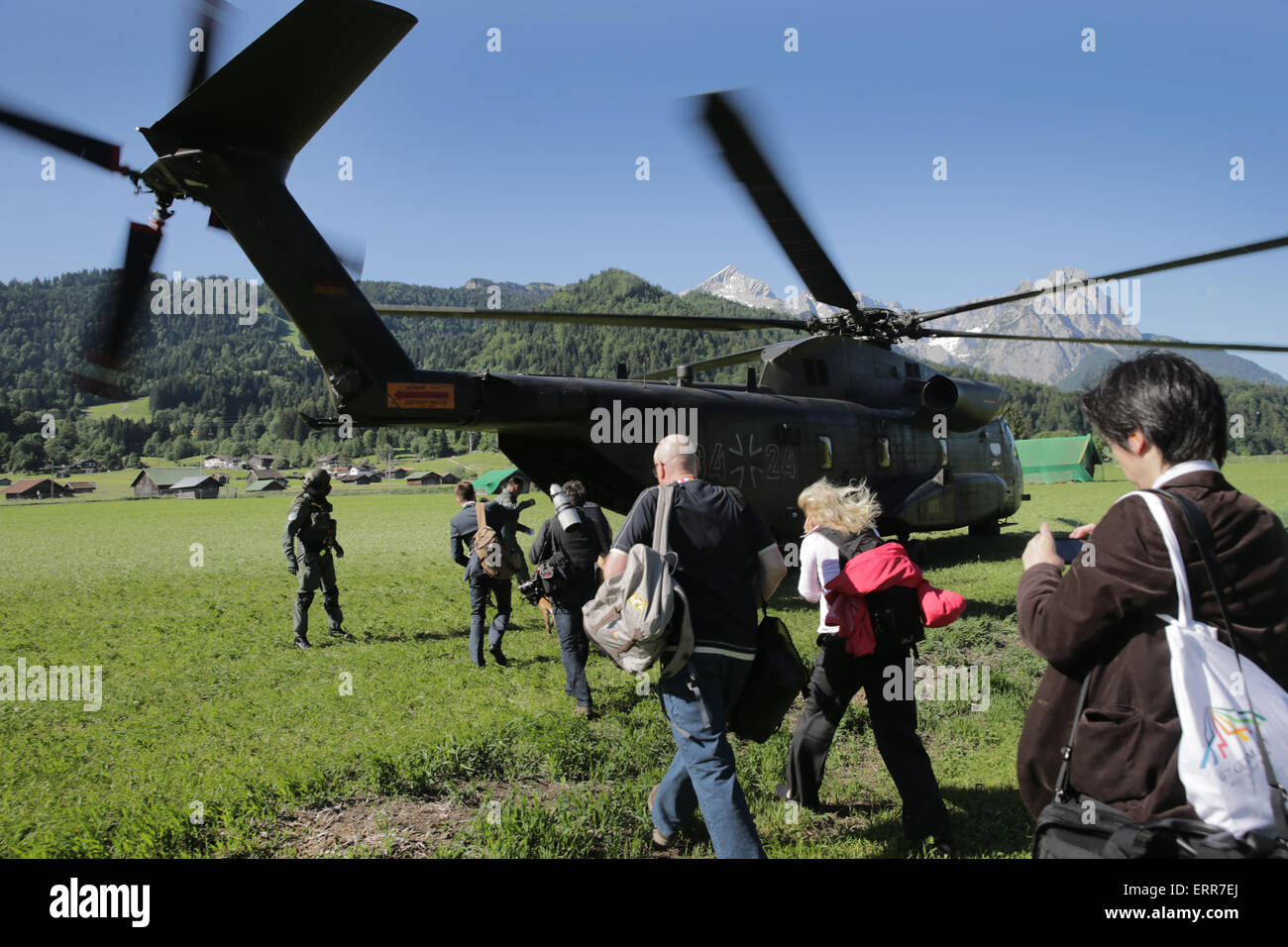 Elmau, Germany. 07th June, 2015. Journalists are flown in helicopters from Garmisch-Partenkirchen to Elmau, Germany, 07 June 2015. Heads of state and government of the seven leading industrialized nations (G7) are scheduled to meet in Elmau Castle, Bavaria, on 07 and 08 June to discuss foreign and security policy. Photo MICHAEL KAPPELER/dpa/Alamy Live News Stock Photo
