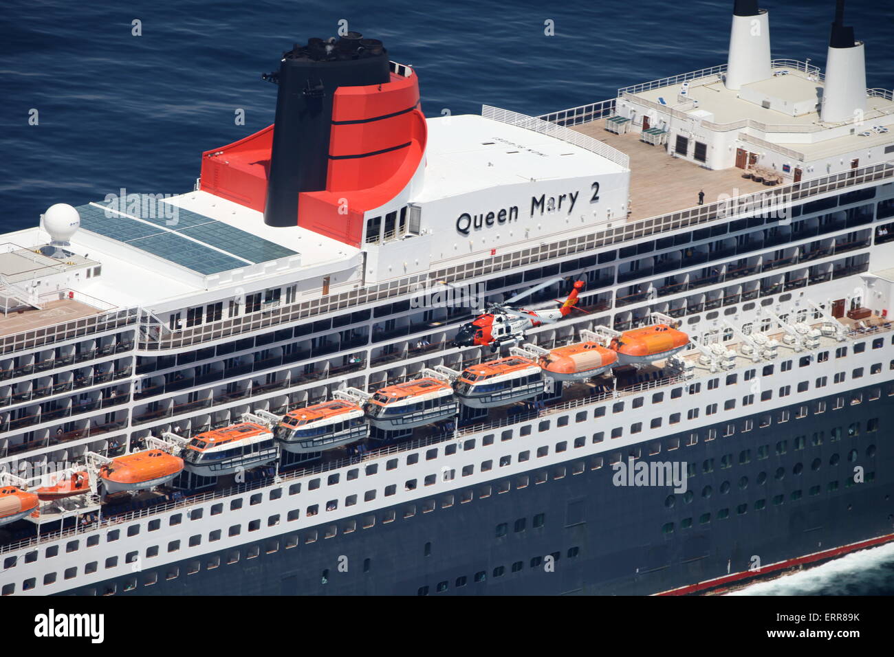The US Coast Guard rescue crews medically evacuated a man from the 992-foot Bermuda flagged cruise ship Queen Mary II by rescue helicopter May 9, 2015 180 miles south of Nantucket, Massachusetts. Stock Photo