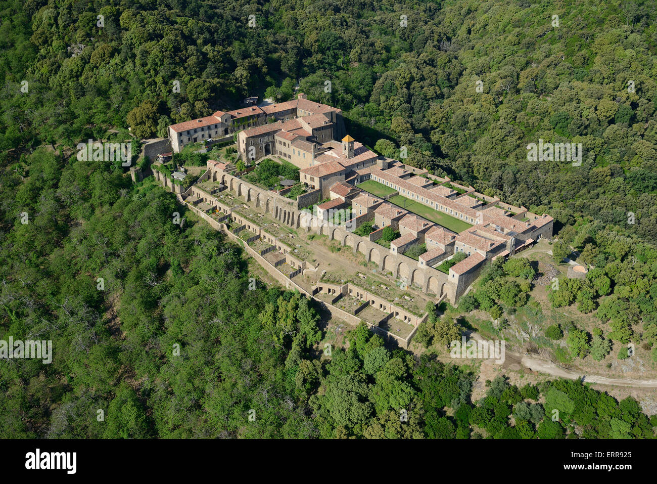 AERIAL VIEW. Monastery isolated in a mountainous area. La Verne Charterhouse, Collobrières, Var, French Riviera's backcountry, France. Stock Photo