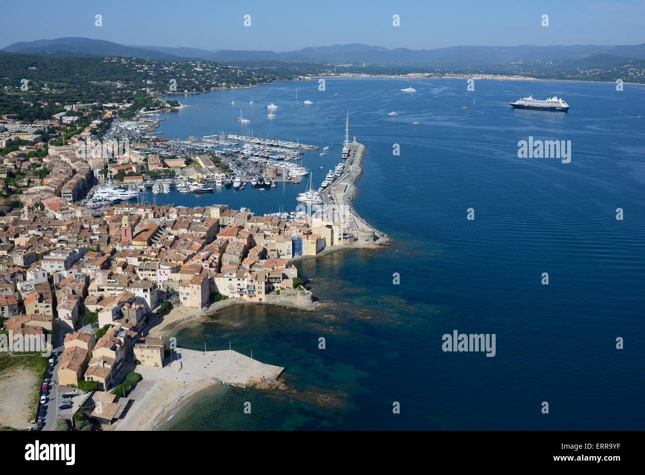 AERIAL VIEW. The Old Village and the marina of Saint-Tropez with its gulf. Var, French Riviera, France. Stock Photo