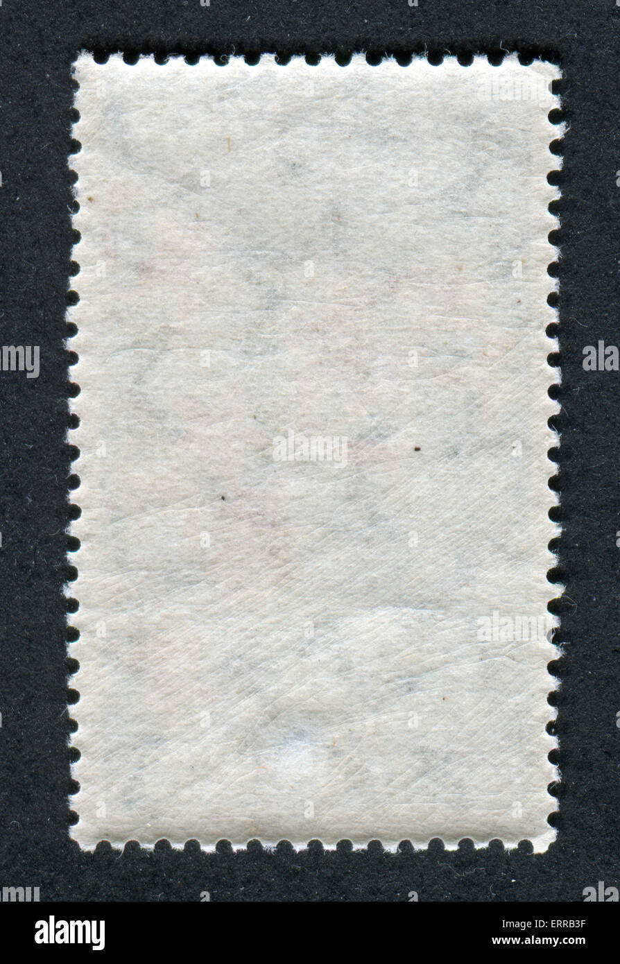 The reverse side of a postage stamp Stock Photo - Alamy