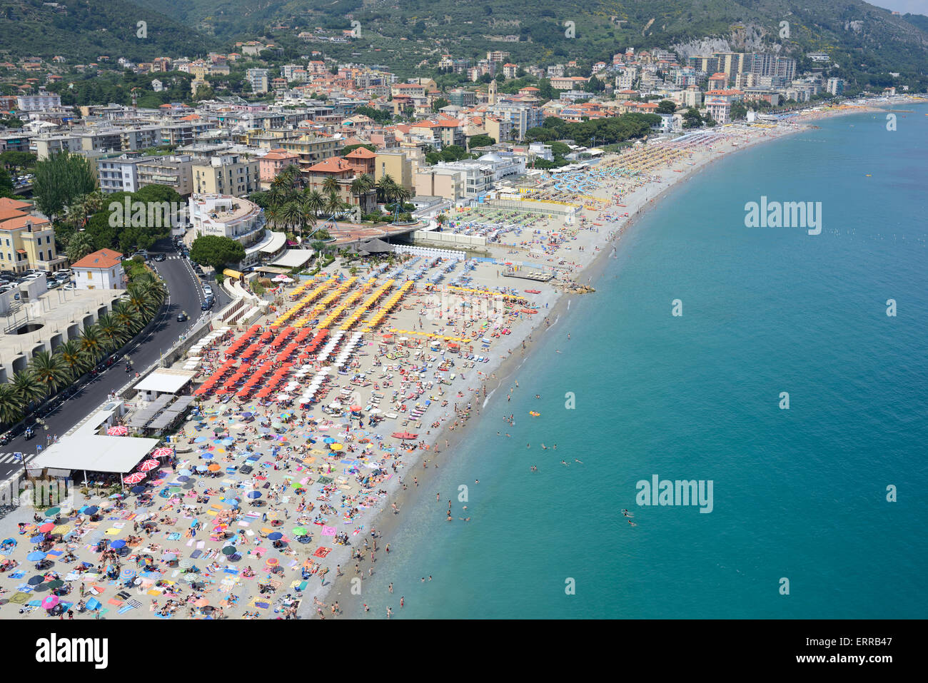 AERIAL VIEW. Crowded sandy beach in Spotorno. Province of Savona, Liguria, Italy. Stock Photo