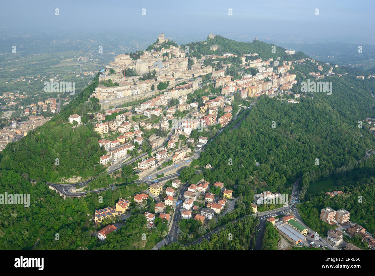 AERIAL VIEW. The capital city of San Marino on the western side of Mount Titano. Republic of San Marino. Stock Photo