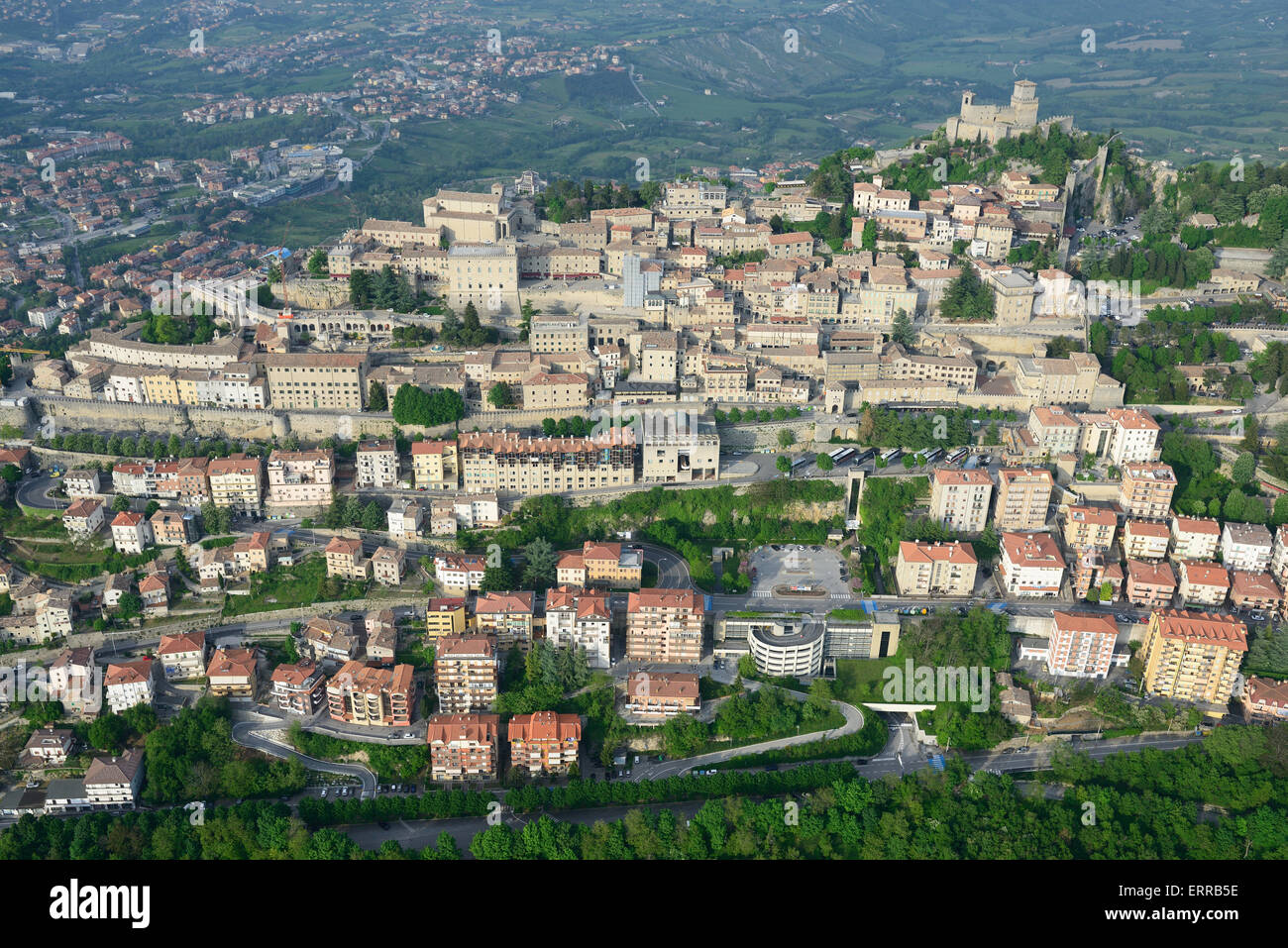 AERIAL VIEW. The capital city of San Marino on the western side of Mount Titano. Republic of San Marino. Stock Photo