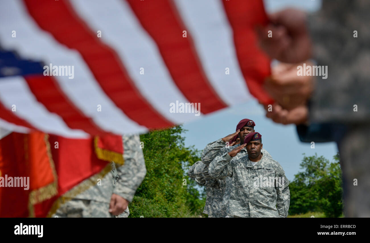 US Army 82nd Airborne paratroopers salute during a memorial ceremony to commemorate the 71st Anniversary of D-Day invasion June 7, 2015 in Sainte Mere Eglise, Normandy, France. Stock Photo
